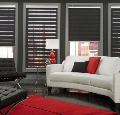Blinds A White Couch in Front of Black Blinds — Winning Blinds in Cardiff, NSW