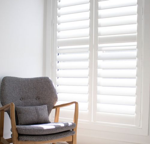 Thermo Select Shutters in Sunny Reading Area for Light Control — Winning Blinds in Cardiff, NSW Thermo Select Shutters in Sunny Reading Area for Light Control — Winning Blinds in Cardiff, NSW